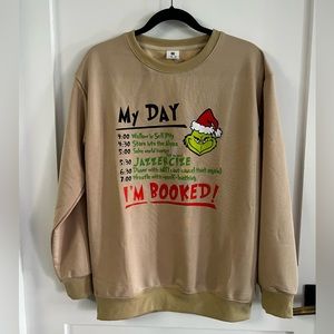 The grinch graphic print tan crew neck Christmas /holiday sweatshirt